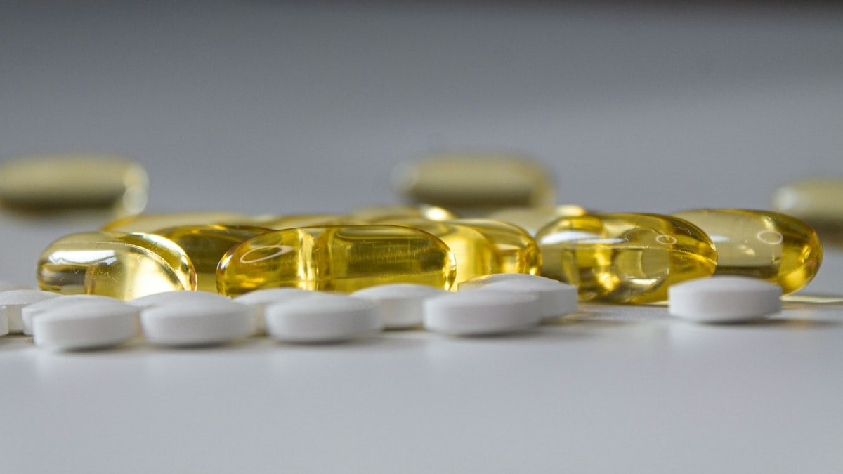 a close up of many pills on a table